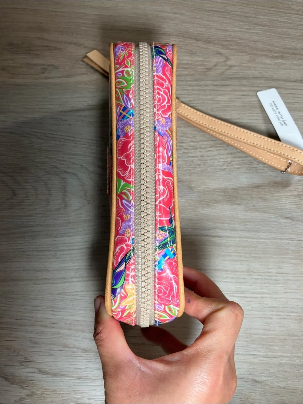 Consuela Pink Floral Embossed Zip Wristlet with Tan Strap